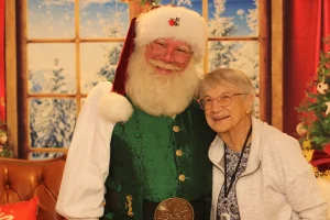 Photo of a senior resident with Santa